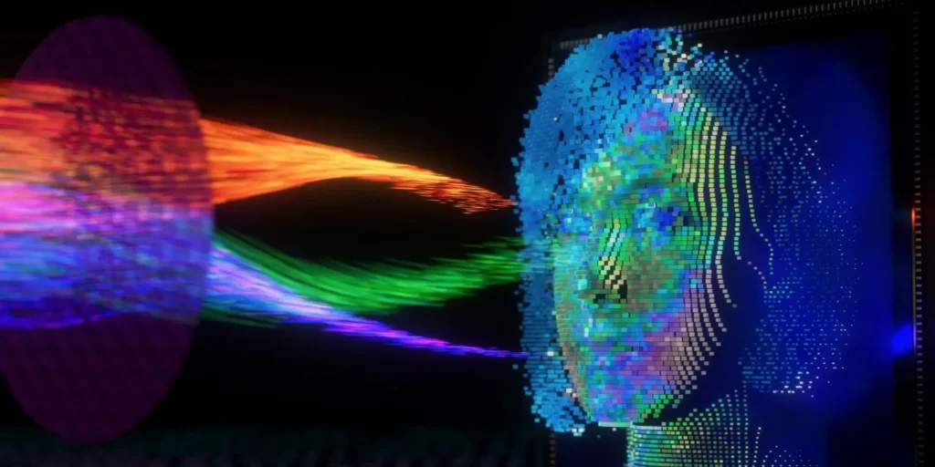 face id 30 tisíc bodů | Venclíkovi.cz Digitální grafika zobrazující technologii Face ID. Obrázek ukazuje lidskou tvář složenou z tisíců barevných bodů, které představují 3D skenování obličeje. Zleva do pravé části obrazu proudí barevné paprsky (červené, zelené a fialové) směřující k digitální tváři, což symbolizuje proces mapování obličeje pomocí infračerveného světla. Tmavé pozadí zdůrazňuje jasné a živé barvy bodů a paprsků, které společně tvoří pokročilou vizualizaci biometrického rozpoznávání obličeje.