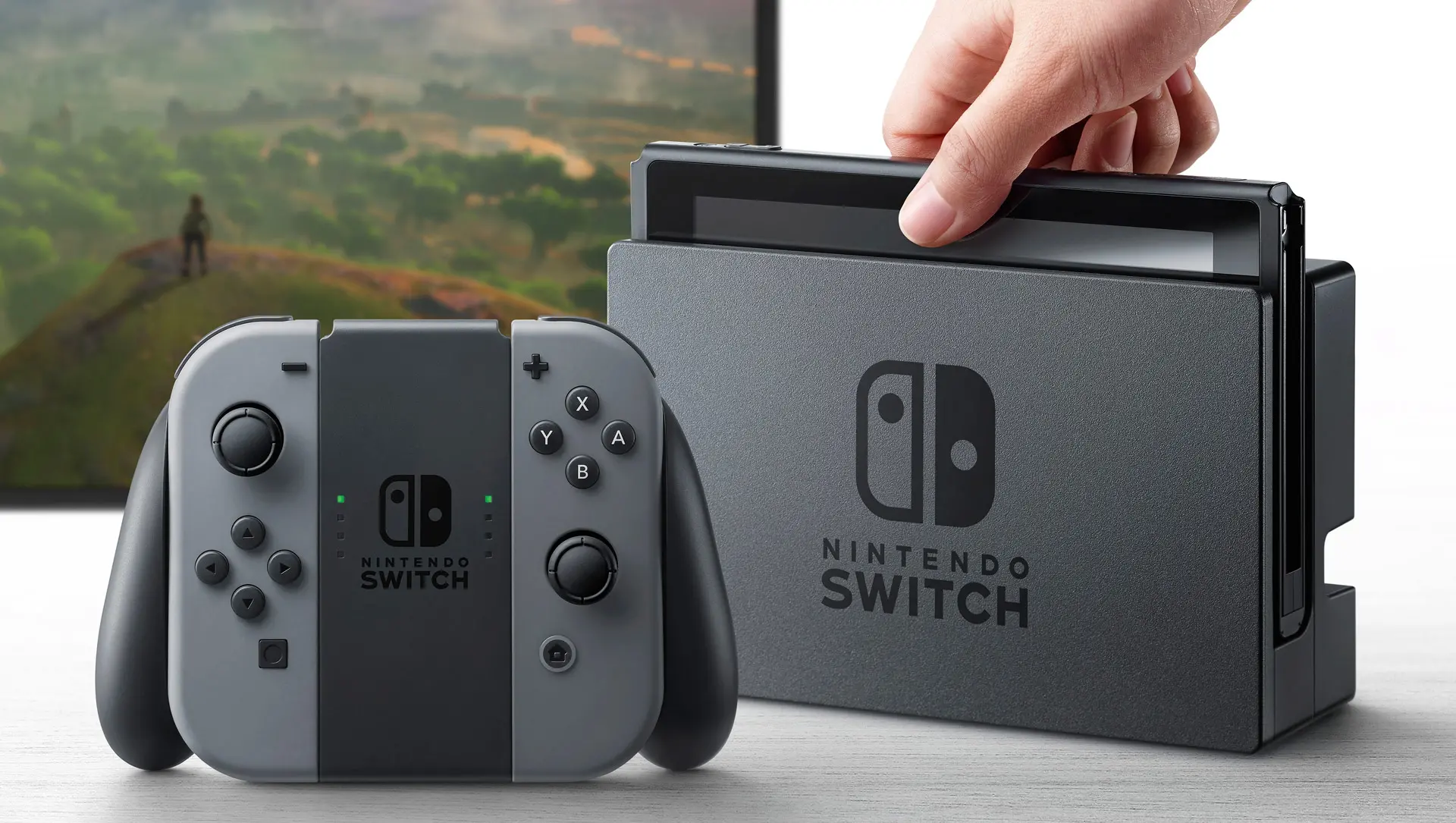 Nintendo Switch 1 konzole | Venclíkovi.cz Klasický Nintendo Switch zasunutý v docku, připravený k hraní na televizi, vedle ovladače Joy‑Con.